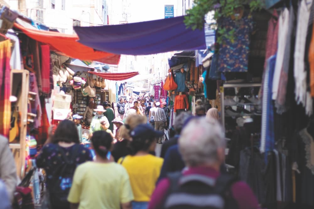 people on road at a market