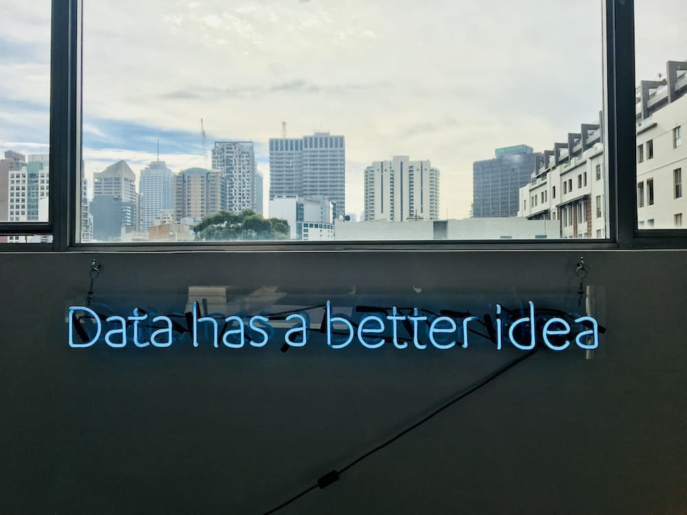 white building with data has a better idea text signage