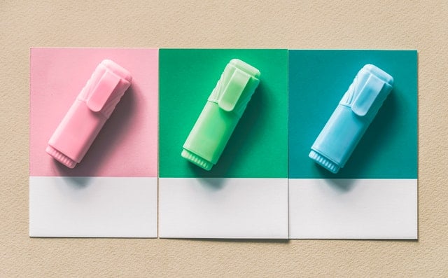 three coloured pens