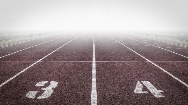 running track with fog on it extending into distance
